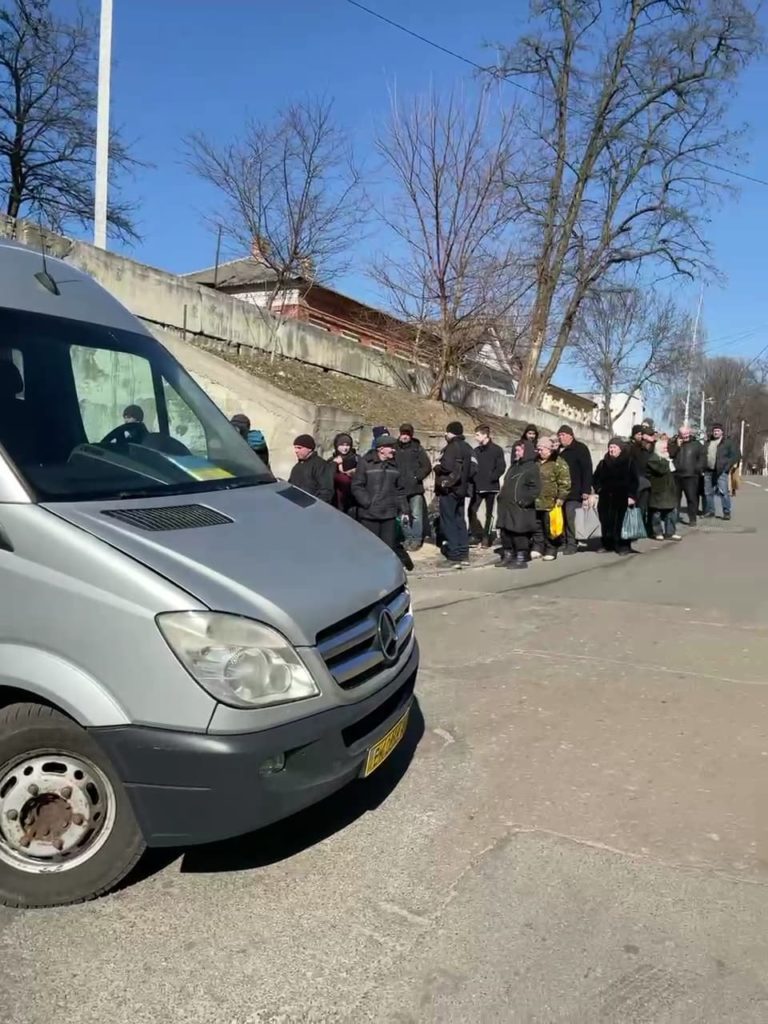 Citizens lining up for supplies outside the church in Chernihiv